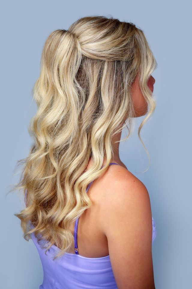 Half-up bridal hairstyle with glam waves